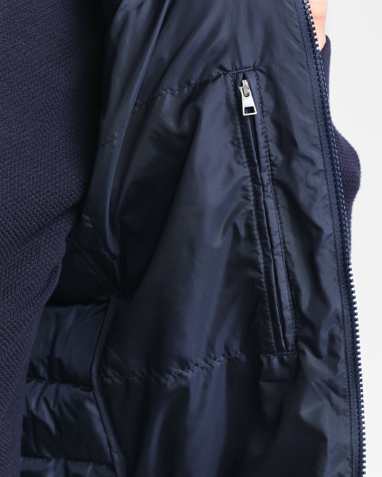 MODEL WEARING LIGHT DOWN VEST