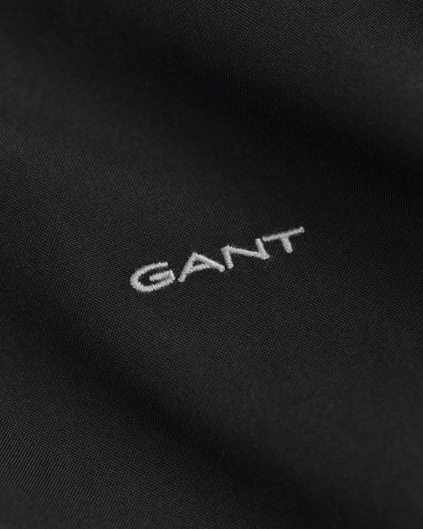 BLACK, REG PINPOINT OXFORD SHIRT, FLAT-LAY BY GANT AU.
