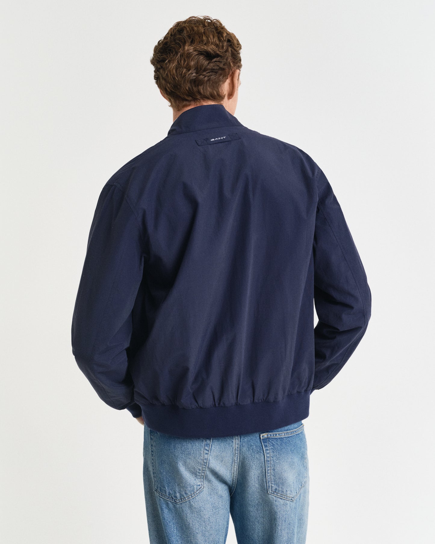 CLASSIC BLUE, REVERSIBLE HARRINGTON JACKET, BACK-VIEW BY GANT AU.