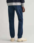 DARK BLUE WORN IN, SLIM GANT JEANS, BACK-VIEW BY GANT AU.