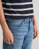 MODEL WEARING SLIM GANT JEANS