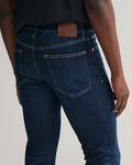 MODEL WEARING EXTRA SLIM ACTIVE RECOVER JEANS