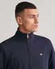 MODEL WEARING REG SHIELD FULL ZIP SWEAT