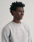 GREY MELANGE, REG TONAL SHIELD C-NECK SWEAT, CLOSE-UP BY GANT AU.