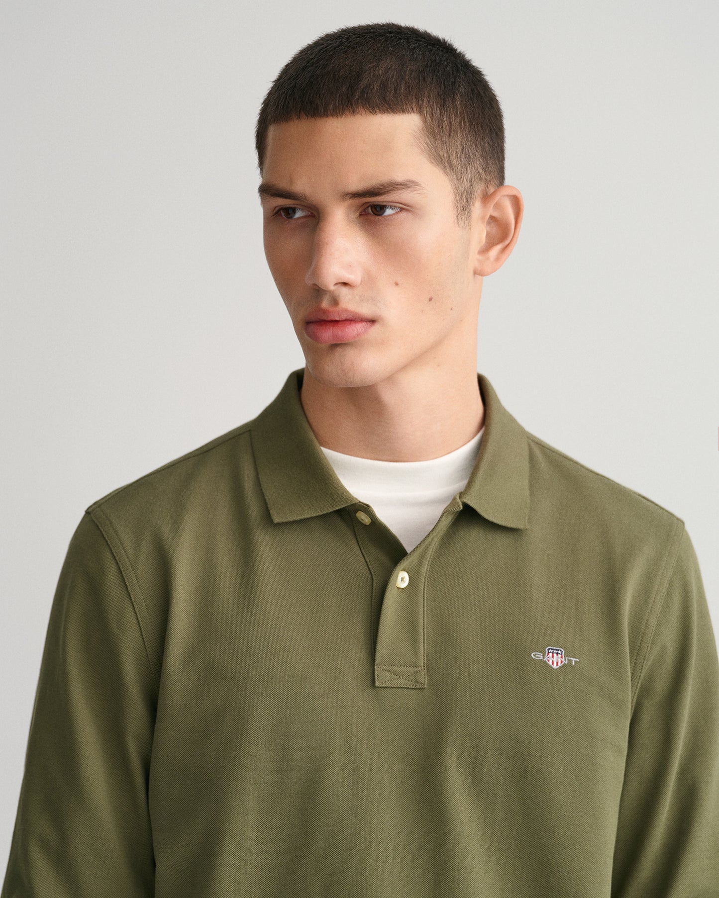 JUNIPER GREEN, REG SHIELD LS PIQUE POLO, CLOSE-UP BY GANT AU.