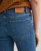 MID BLUE BROKEN IN, SLIM SUPER STRETCH JEANS, CLOSE-UP BY GANT AU.