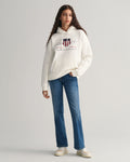 MODEL WEARING REL ARCHIVE SHIELD HOODIE