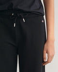 MODEL WEARING SHIELD SWEATPANTS