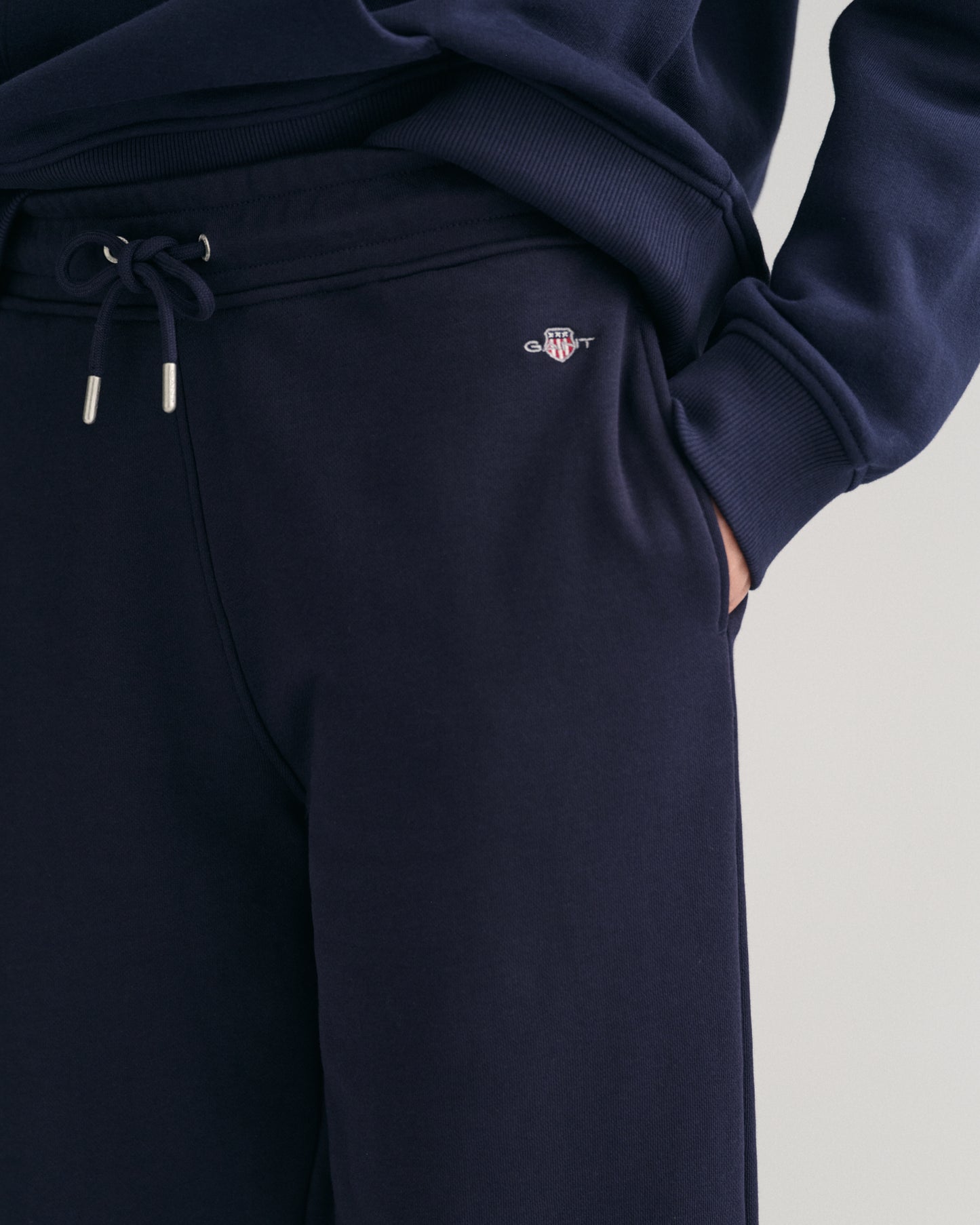 MODEL WEARING SHIELD SWEATPANTS