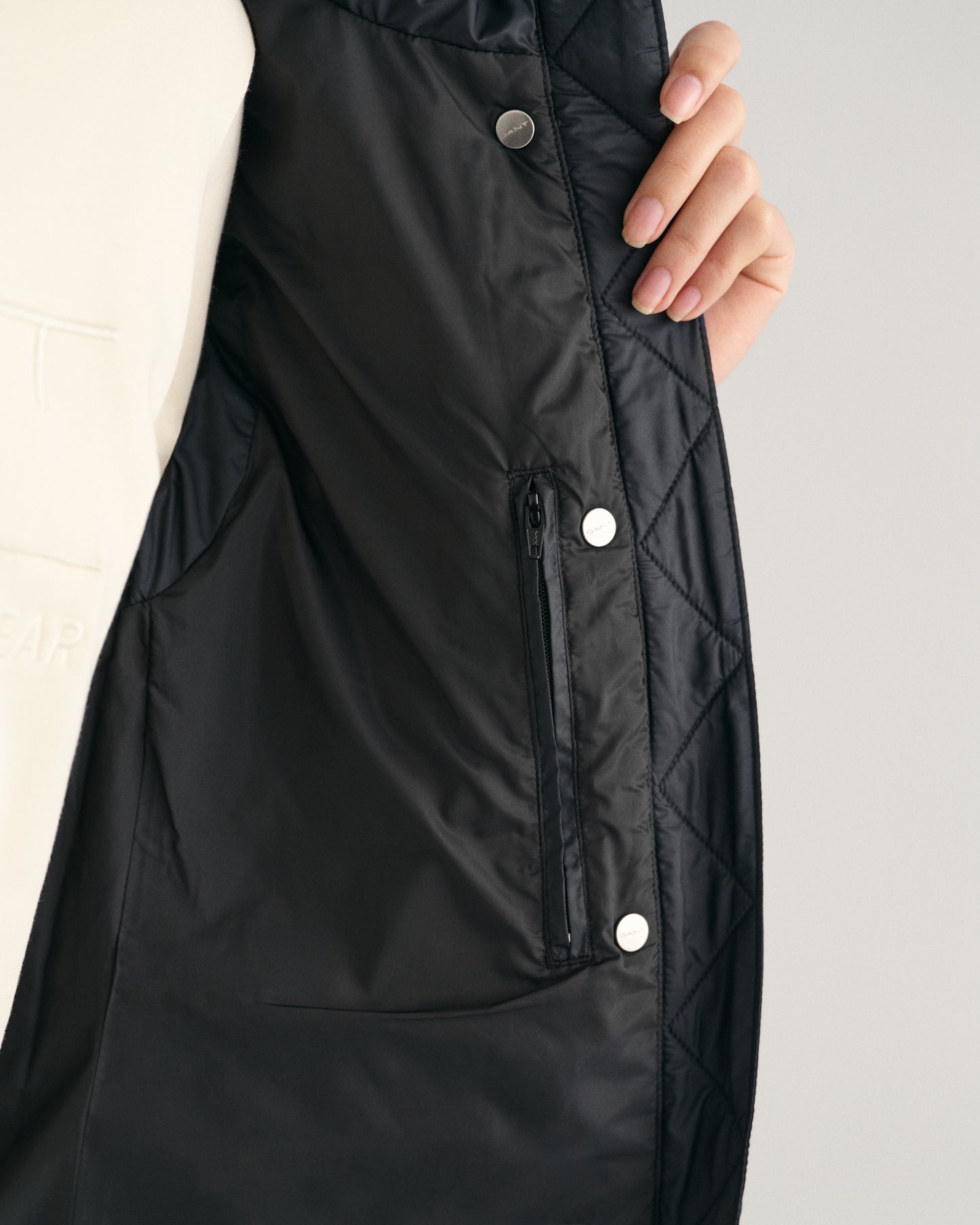 MODEL WEARING LIGHT DOWN VEST