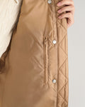 MODEL WEARING LIGHT DOWN VEST