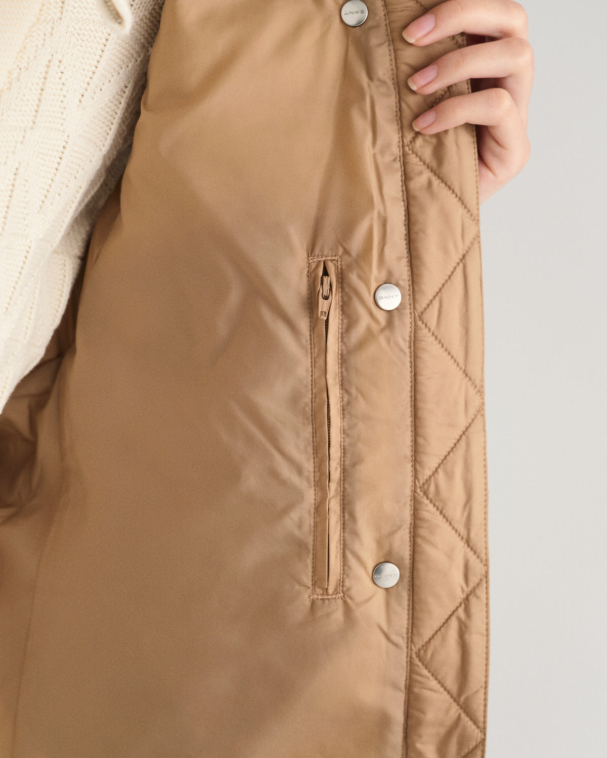 MODEL WEARING LIGHT DOWN VEST