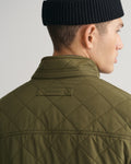 MODEL WEARING QUILTED WINDCHEATER VEST
