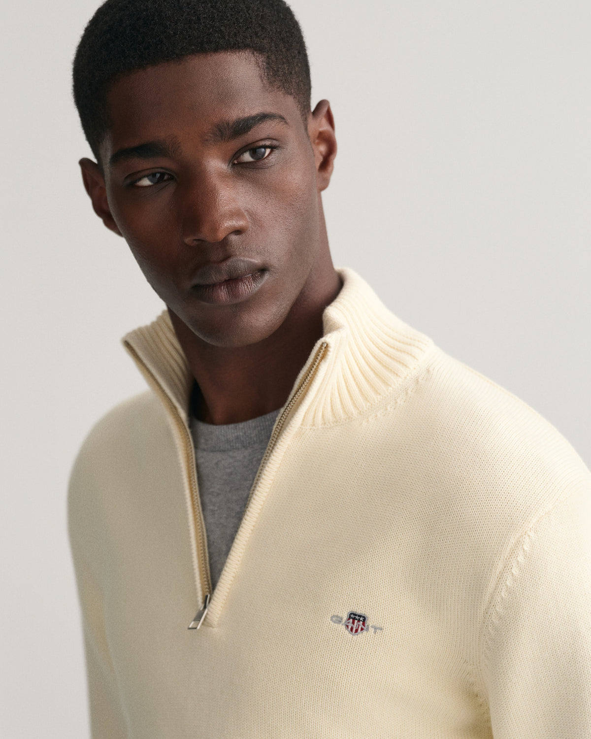 MODEL WEARING CASUAL COTTON HALF ZIP