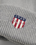 GREY MELANGE, ARCHIVE SHIELD COTTON BEANIE, CLOSE-UP BY GANT AU.