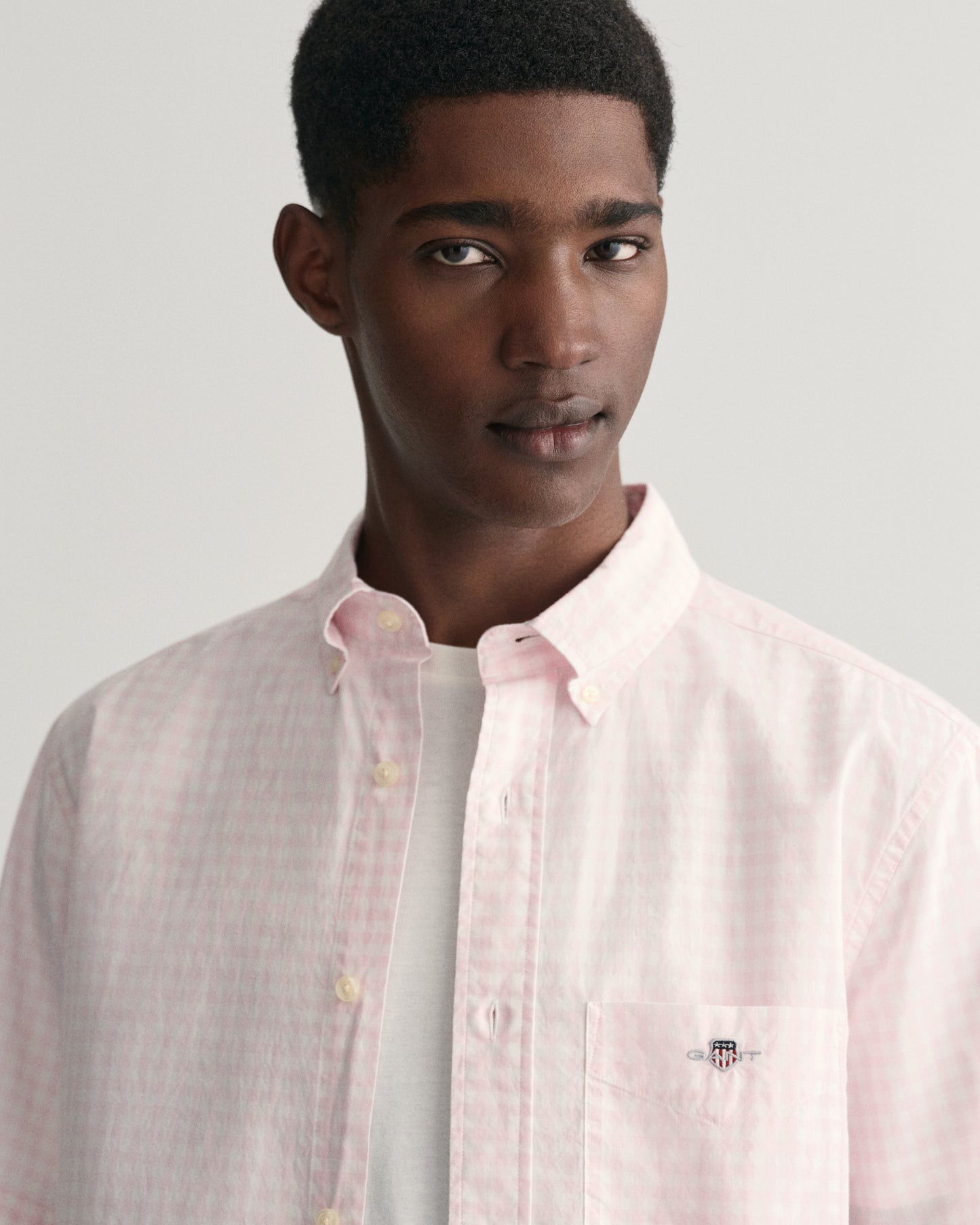 MODEL WEARING REG POPLIN GINGHAM SS SHIRT