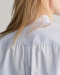 MODEL WEARING REL CLASSIC POPLIN SHIRT