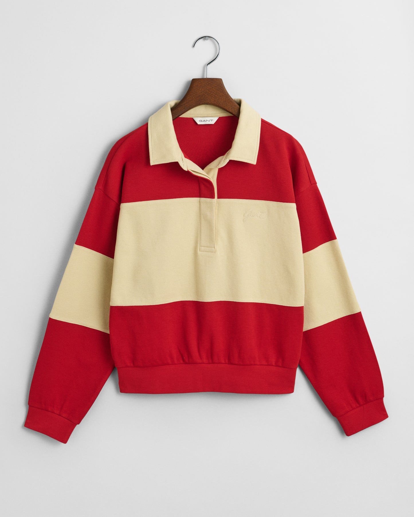 RUBY RED, PIQUE TEXTURE COLOR BLOCK RUGGER, FLAT-LAY BY GANT AU.