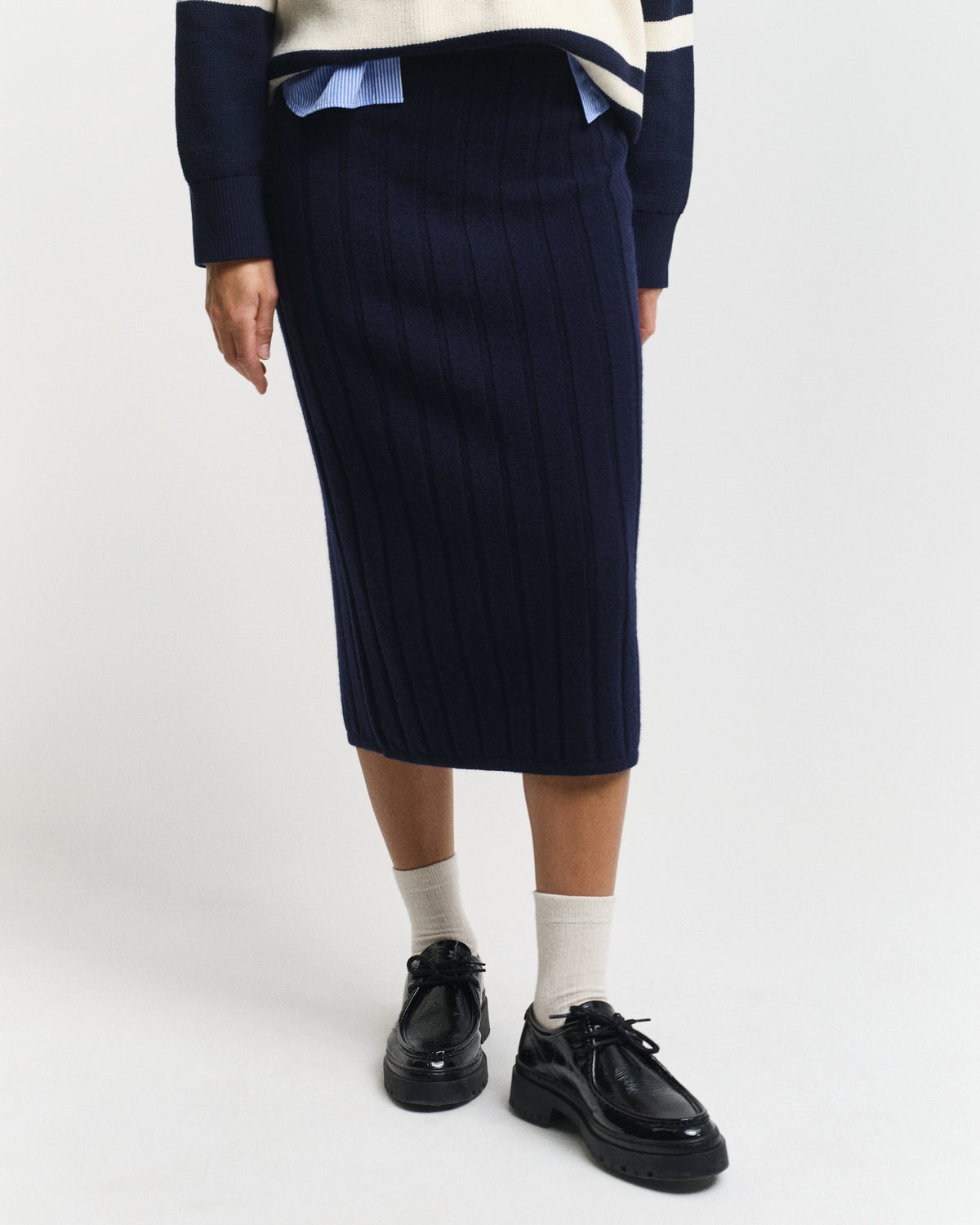 MODEL WEARING WIDE RIBBED WOOL SKIRT