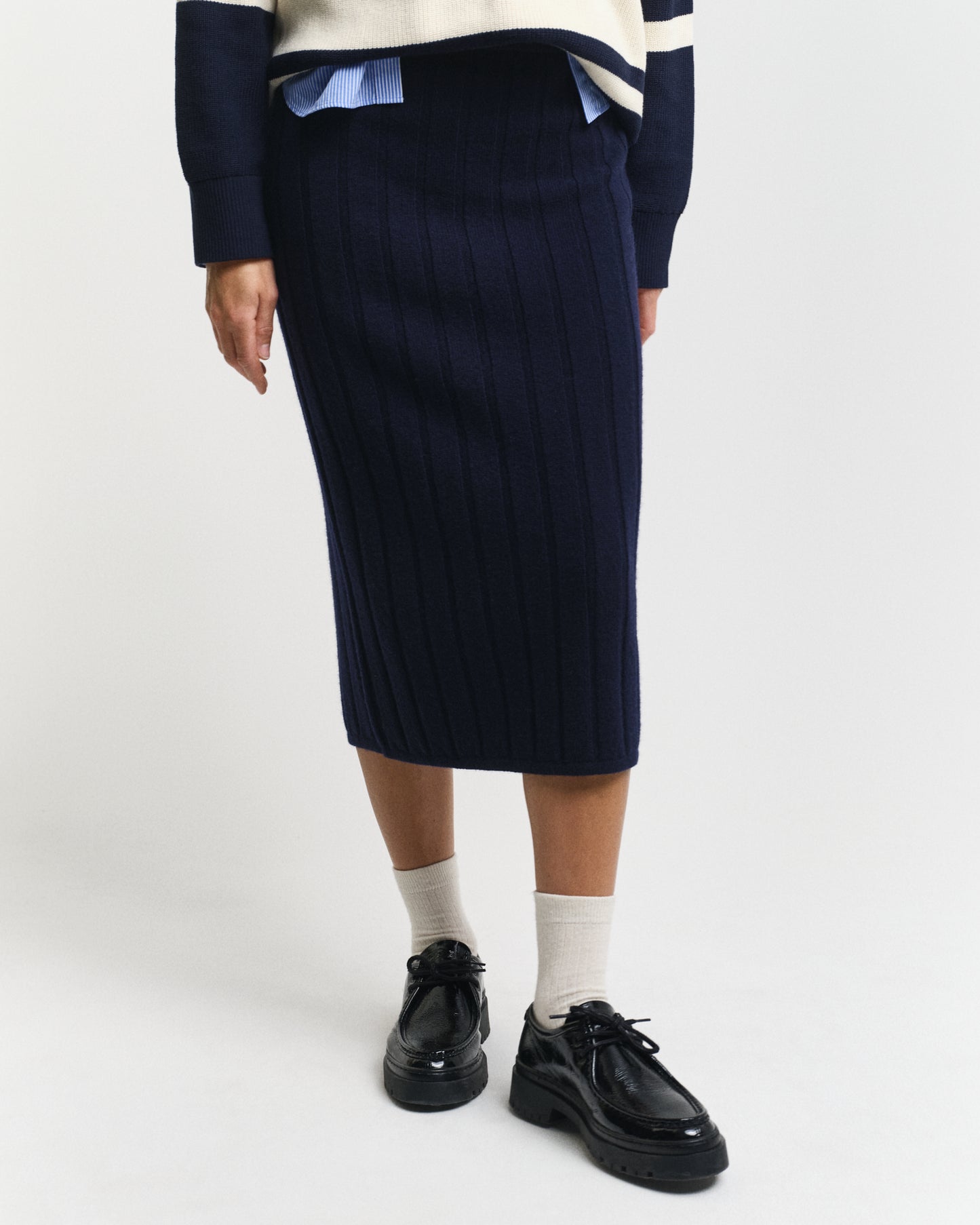 MODEL WEARING WIDE RIBBED WOOL SKIRT