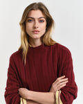 MODEL WEARING WIDE RIBBED WOOL STAND COLLAR