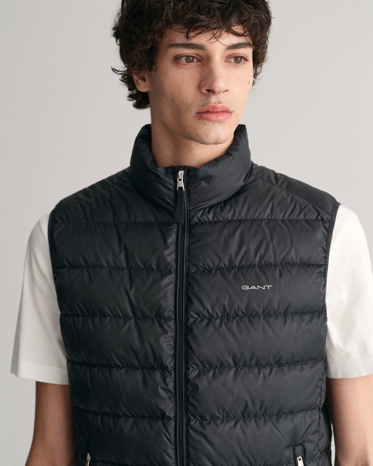 MODEL WEARING LIGHT DOWN VEST