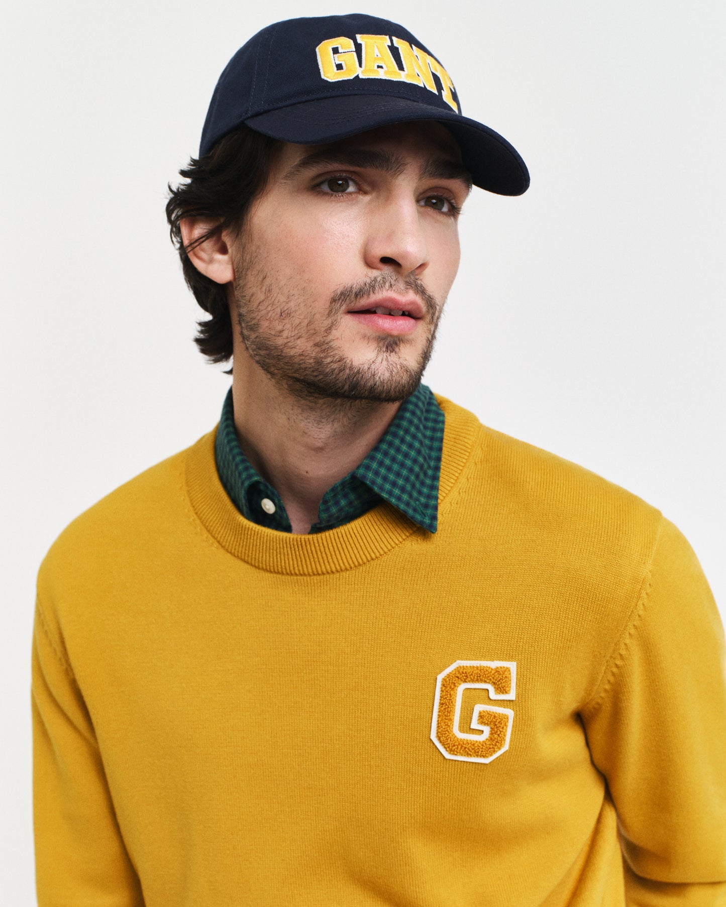 MODEL WEARING BADGE C-NECK