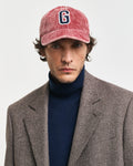 PLUMPED RED, G BADGE WASHED CORD CAP BY GANT AU.