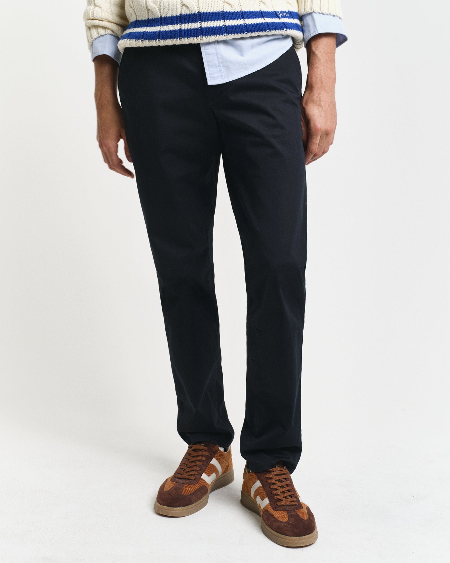 MODEL WEARING SLIM TWILL CHINOS