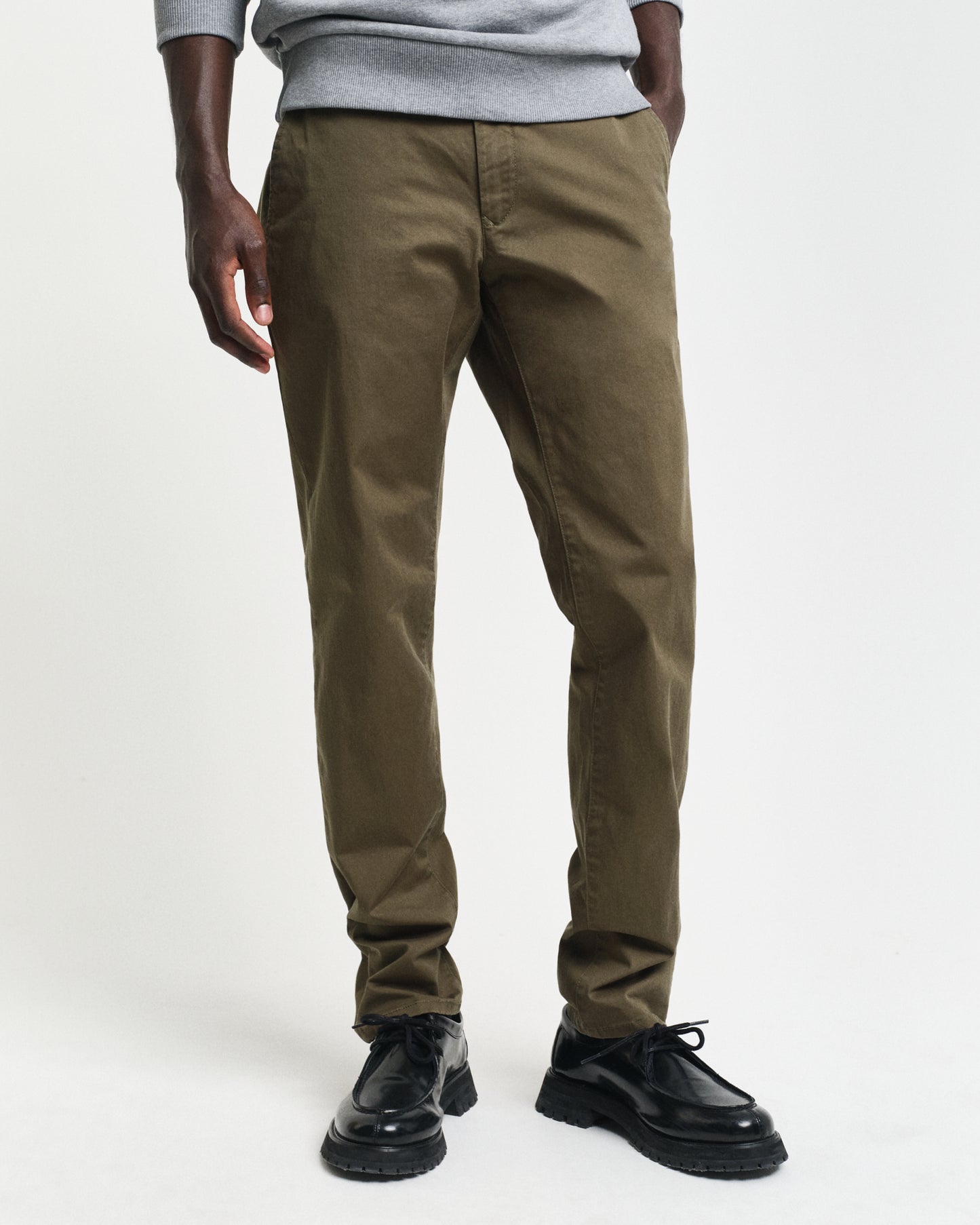 MODEL WEARING SLIM TWILL CHINOS