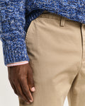 MODEL WEARING REGULAR TWILL CHINOS