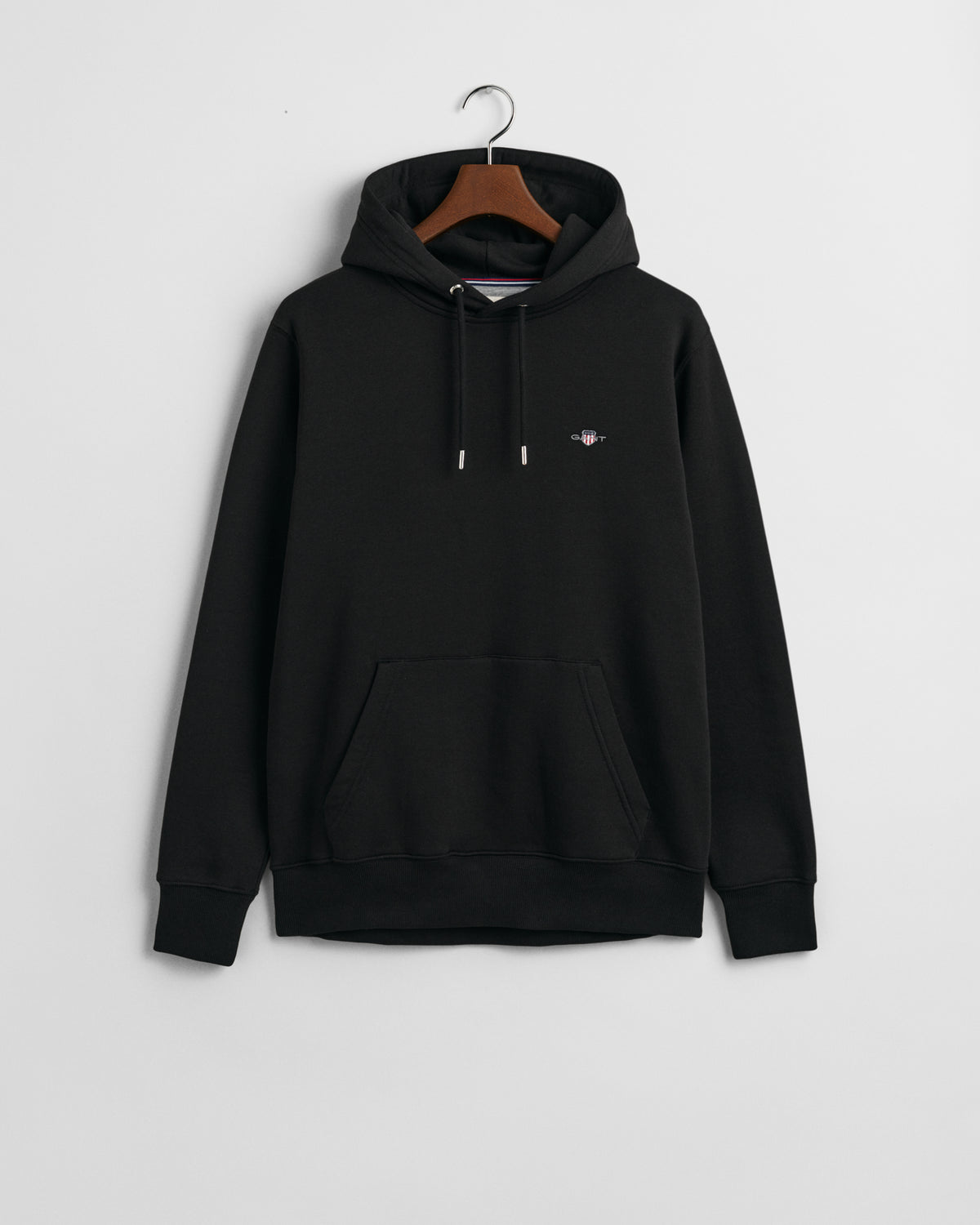 BLACK, REG SHIELD HOODIE, FLAT-LAY BY GANT AU.