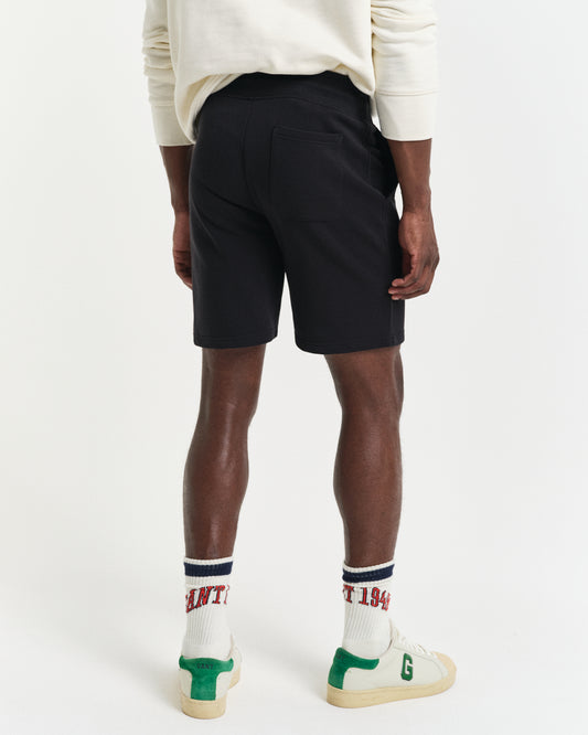 BLACK, REG SHIELD SWEAT SHORTS, BACK-VIEW BY GANT AU.