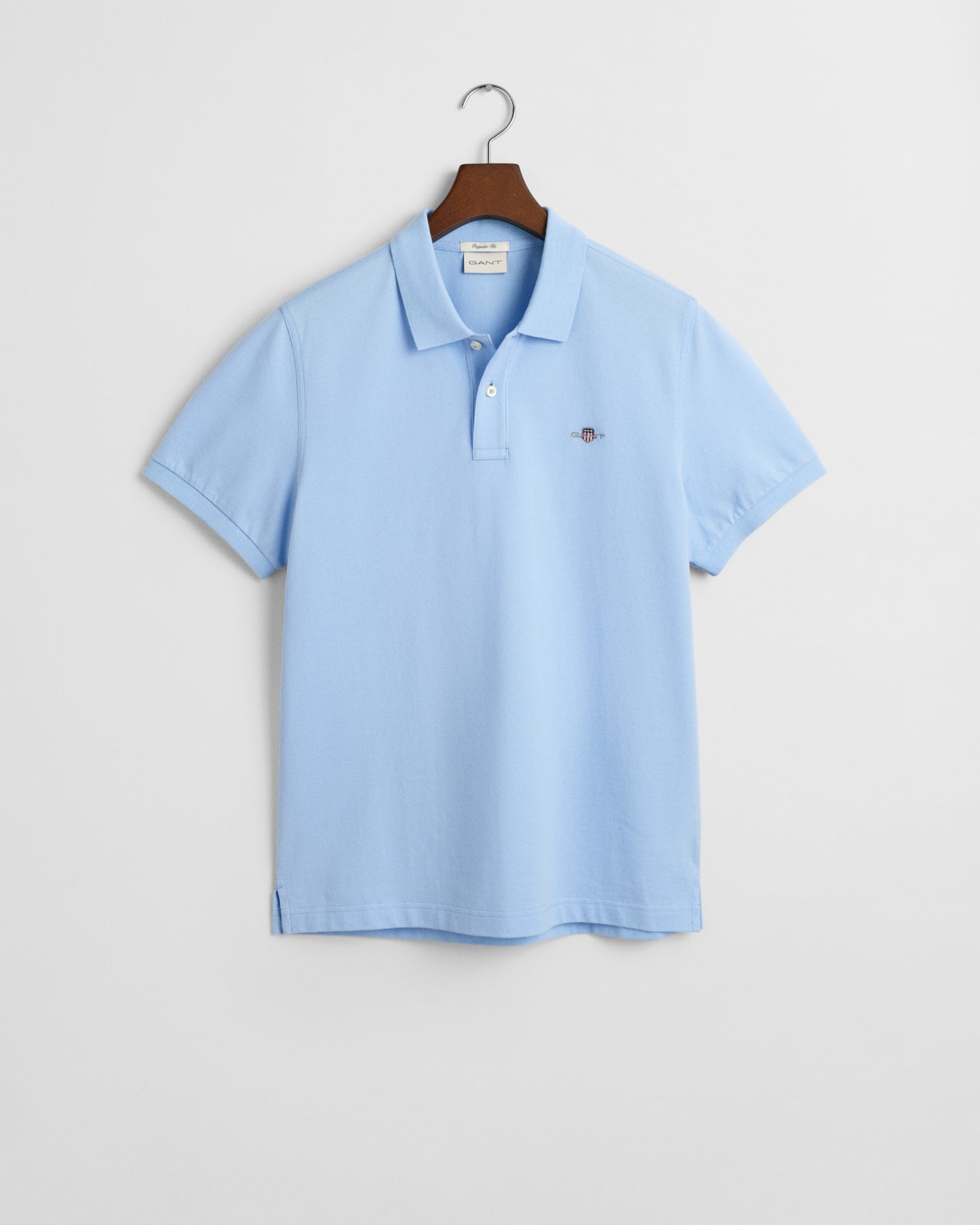 CAPRI BLUE, REG SHIELD SS PIQUE POLO, FLAT-LAY BY GANT AU.