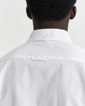 MODEL WEARING SLIM PINPOINT OXFORD SHIRT