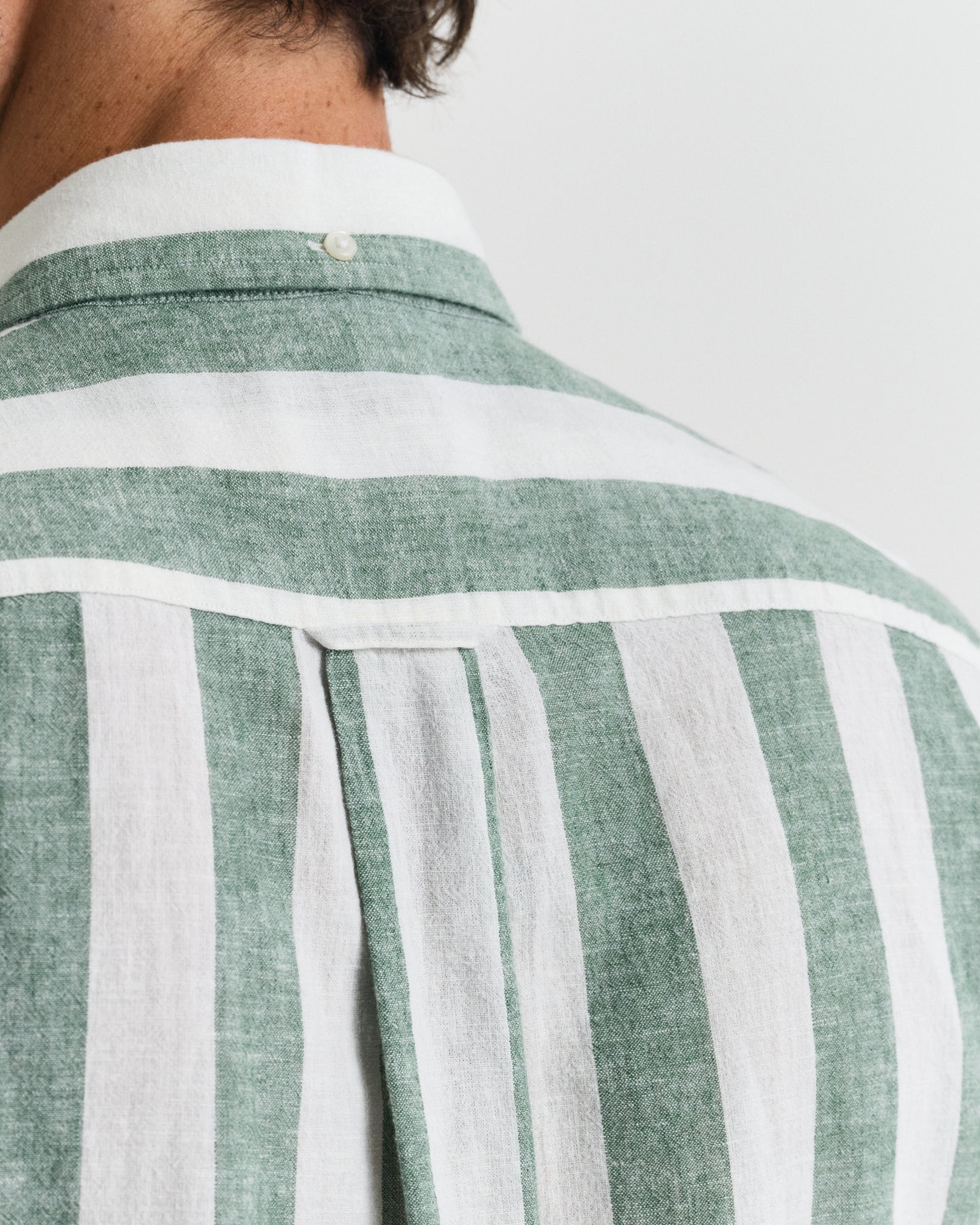 MODEL WEARING REG COTTON LINEN STRIPE SS SHIRT