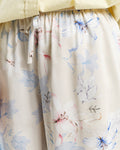 MODEL WEARING REL FLORAL PRINT SHORTS