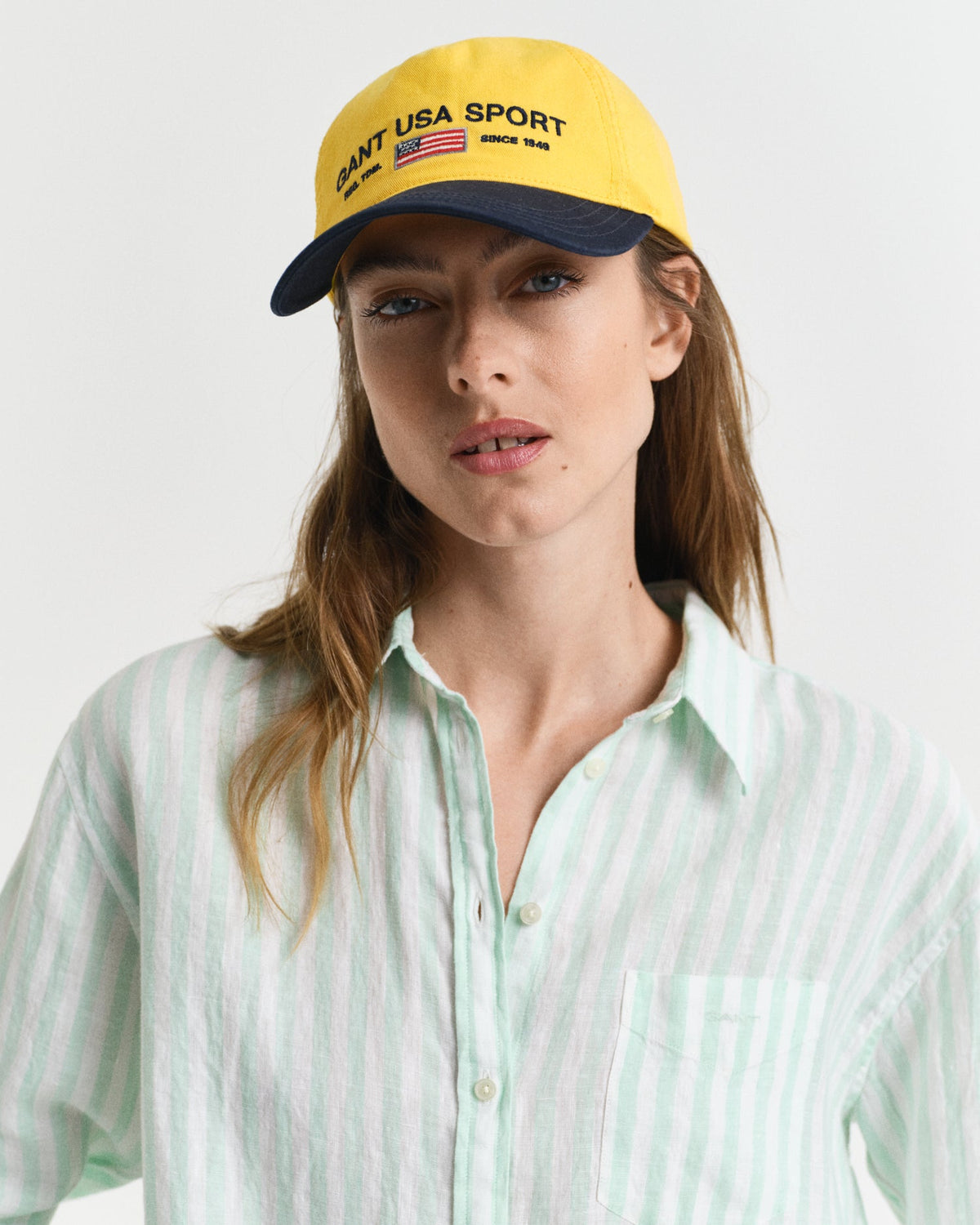 MODEL WEARING REL STRIPED LINEN SHIRT