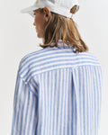 MODEL WEARING REL STRIPED LINEN SHIRT