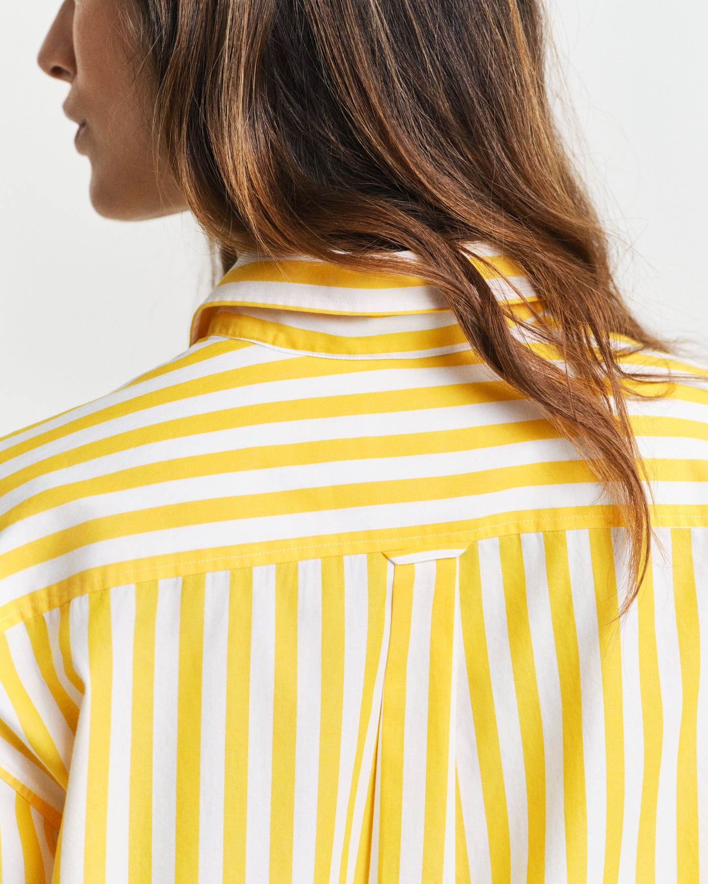 MODEL WEARING REL CLASSIC POPLIN STRIPED SHIRT