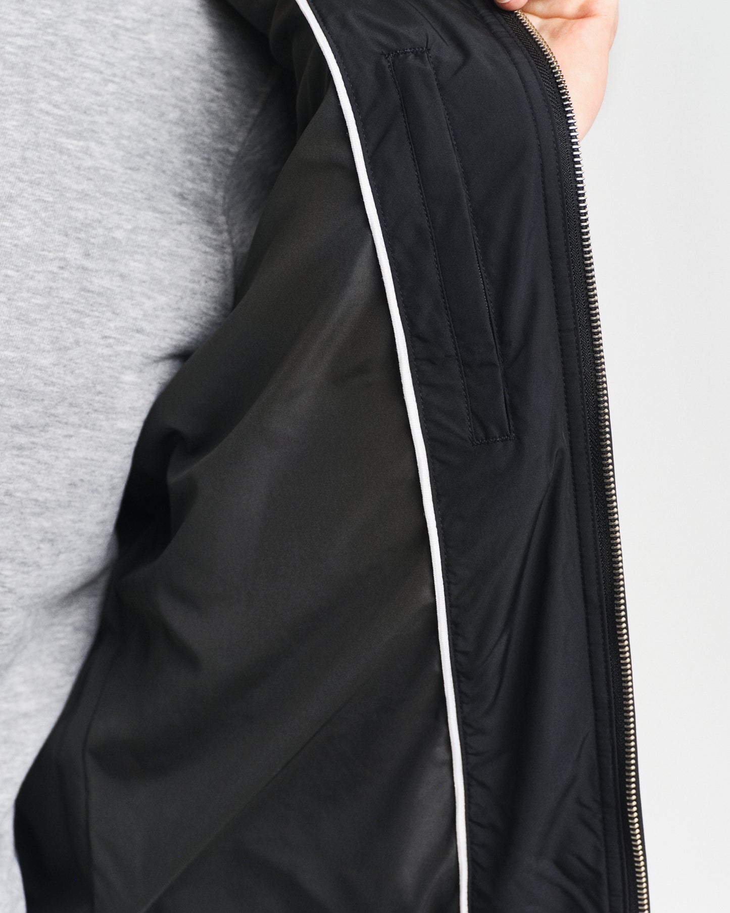 MODEL WEARING QUILTED WINDCHEATER VEST