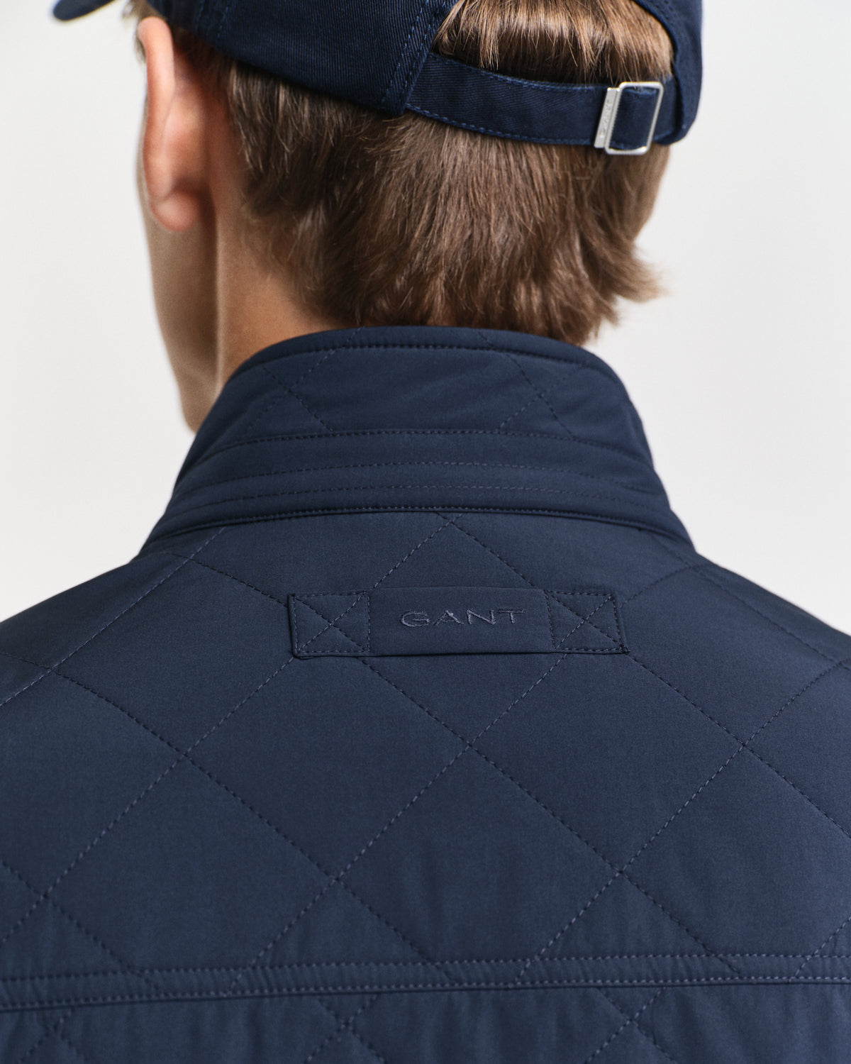 MODEL WEARING QUILTED WINDCHEATER VEST