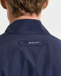 CLASSIC BLUE, REVERSIBLE HARRINGTON JACKET, CLOSE-UP BY GANT AU.
