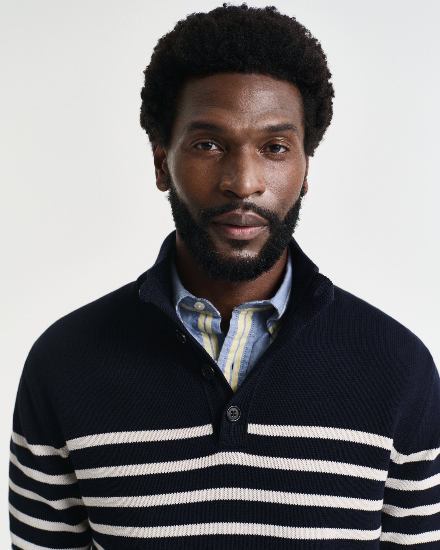 MODEL WEARING STRIPED COTTON HALF BUTTONED NECK