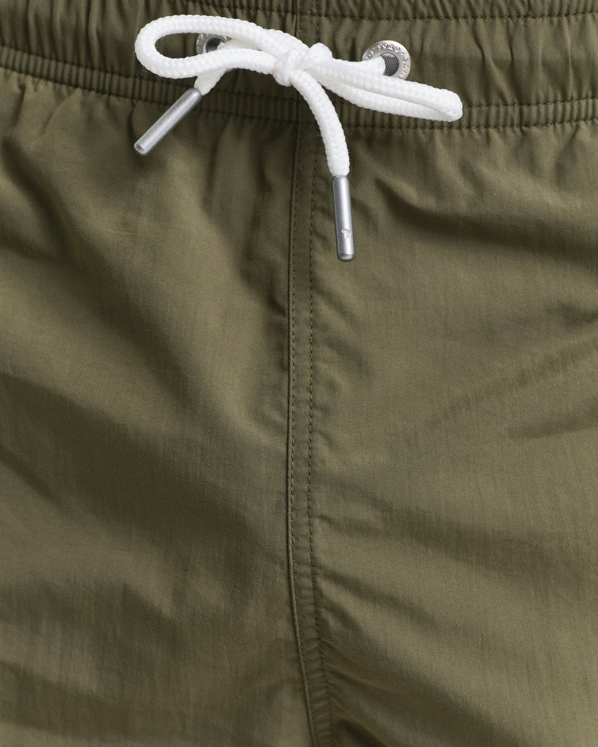 MODEL WEARING SWIM SHORTS