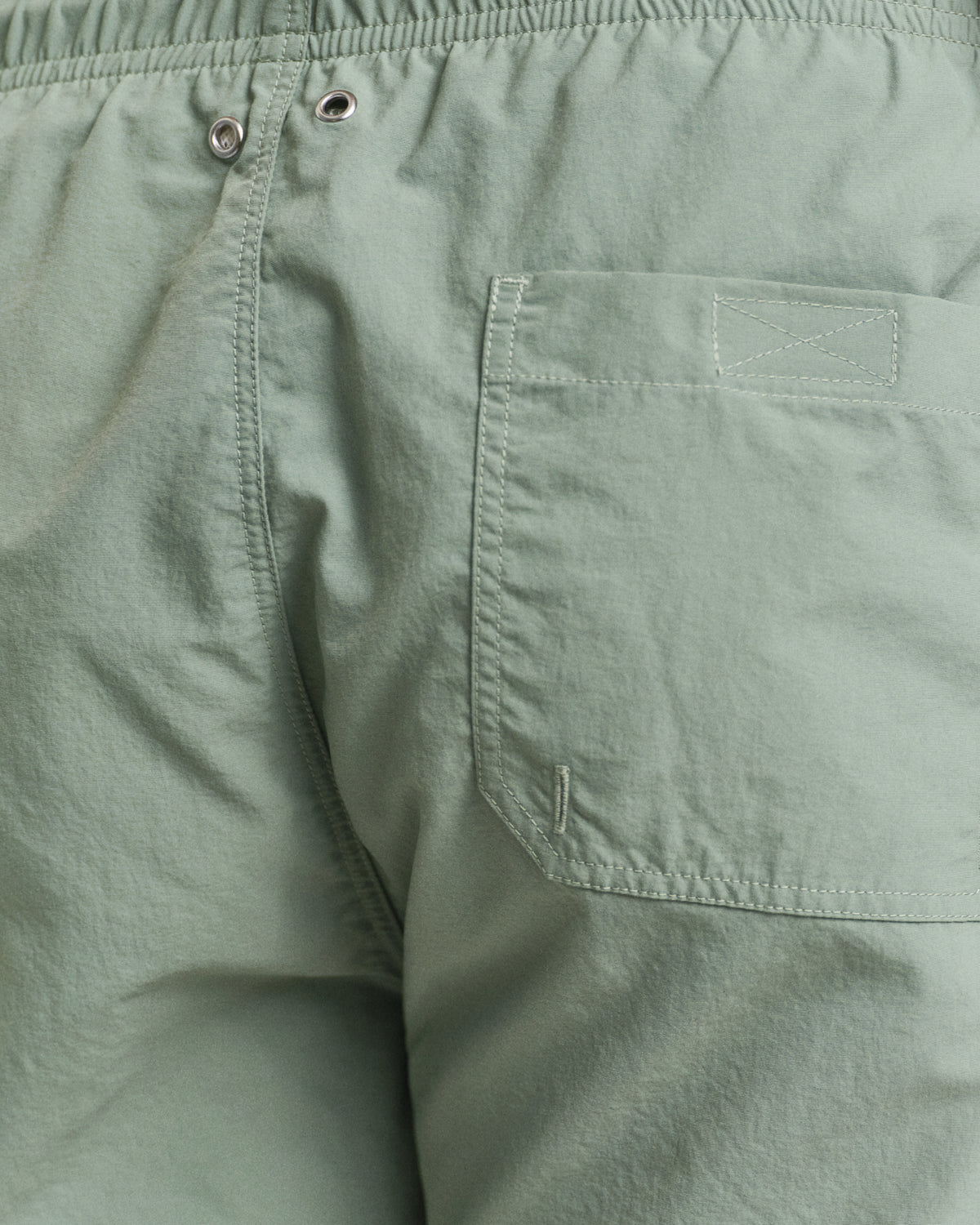 MODEL WEARING SWIM SHORTS