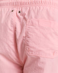 MODEL WEARING SWIM SHORTS