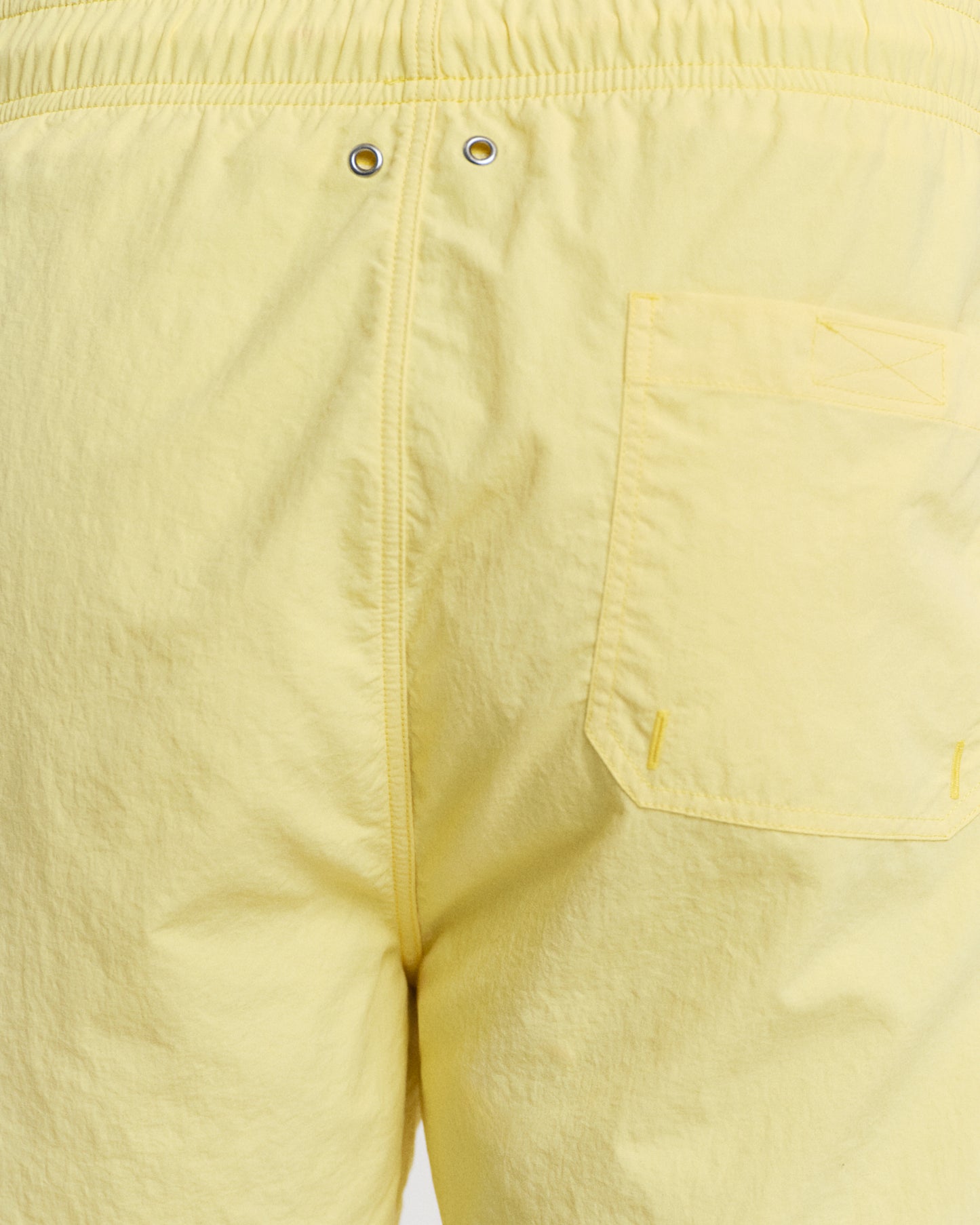 MODEL WEARING SWIM SHORTS