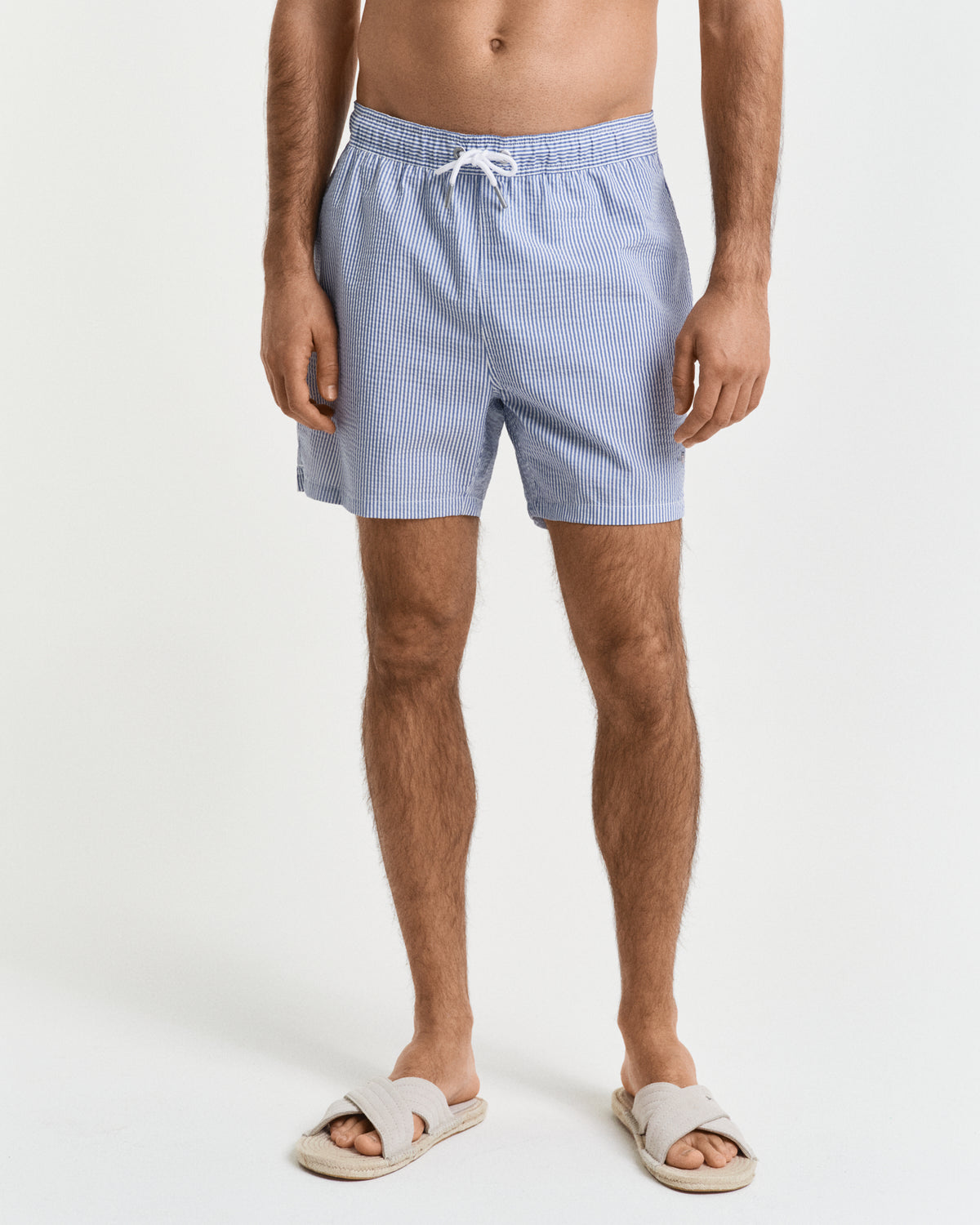 MODEL WEARING SEERSUCKER SWIM SHORTS