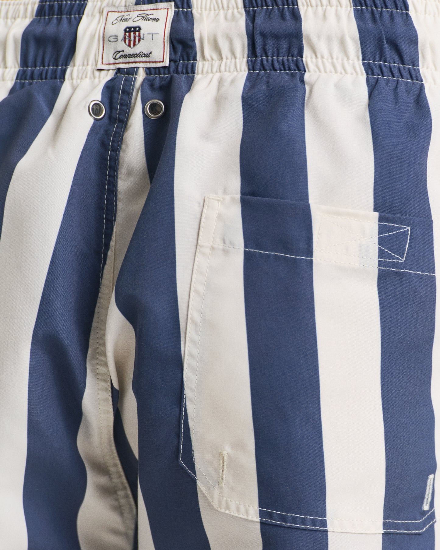MODEL WEARING BLOCK STRIPE SWIM SHORTS